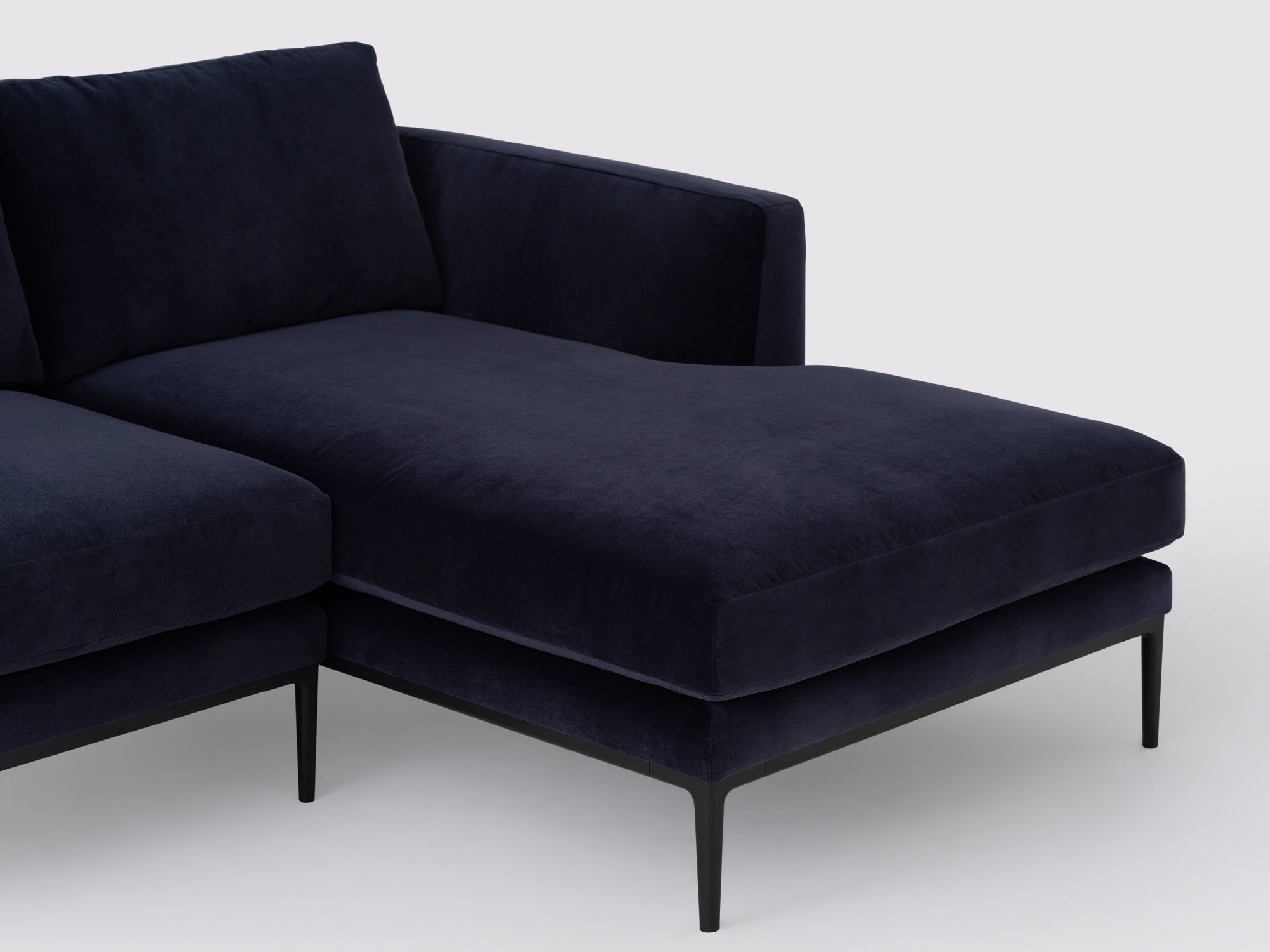 Detail chaise view of the Oma modern sectional couch in blue velvet